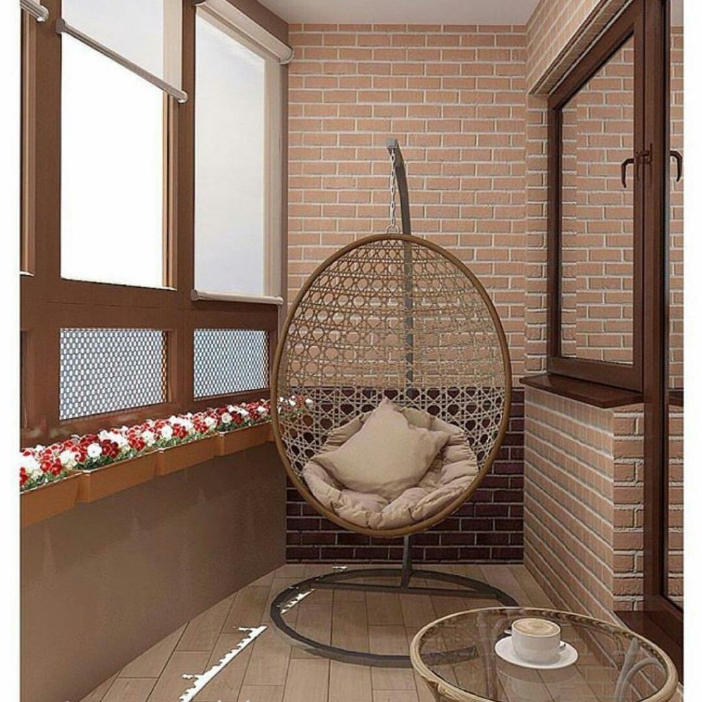 балкон с плетеной мебелью