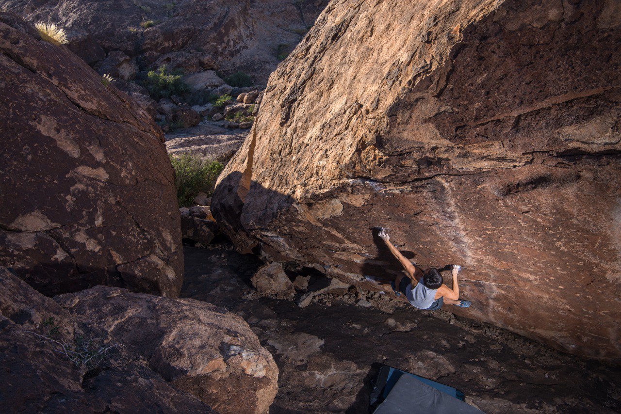 Matt Maa holding tight on Free Willy (V10/11) in Hueco Tanks outside El Paso