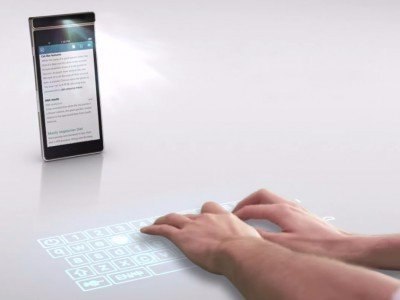 Смартфон Lenovo Smart Cast сможет создавать на столе виртуальную клавиатуру.На проходящей в Пекине ...