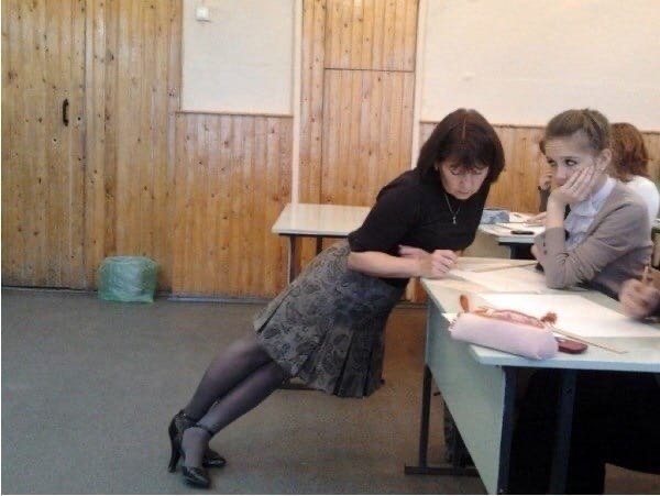 Она ведь просто удобно встала проверить тетрадку